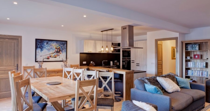 Chalet Caroline in La Tania has a lovely open living space with comfy sofas and huge windows