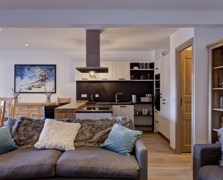 Ski Magic Chalet Caroline La Tania - living room with sofas and open plan kitchen
