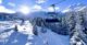 Skiing in the Three Valleys: Biollay chairlift and Saulire in background