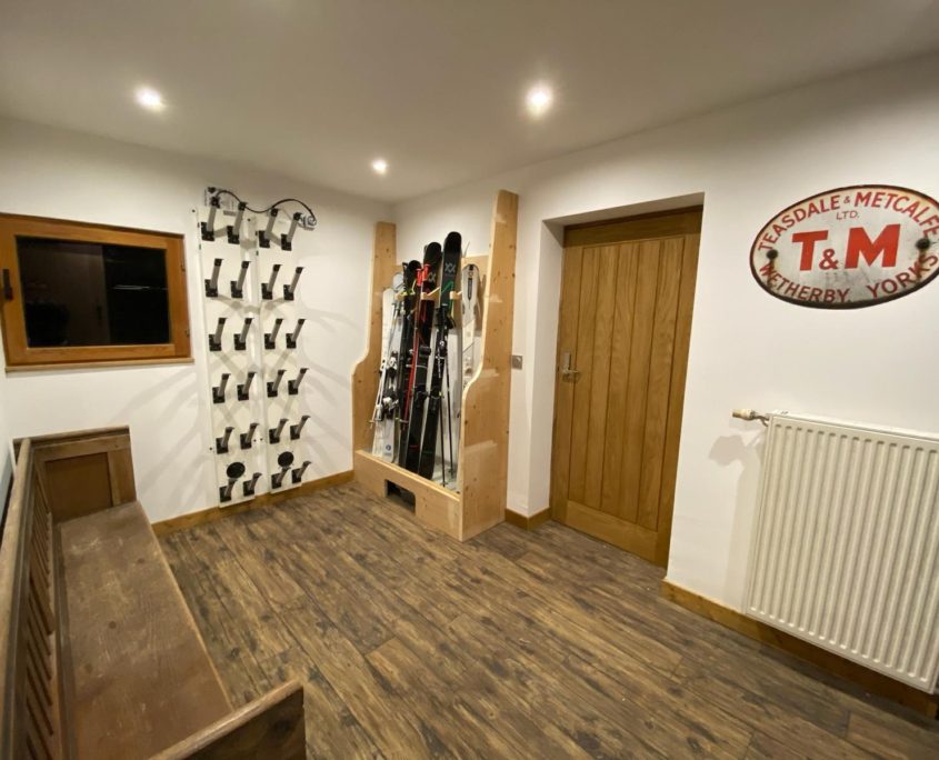 ski and boot room of Chalet Chu Lo Dou in Courchevel Le Praz. Shows ski rack and boot warmer.