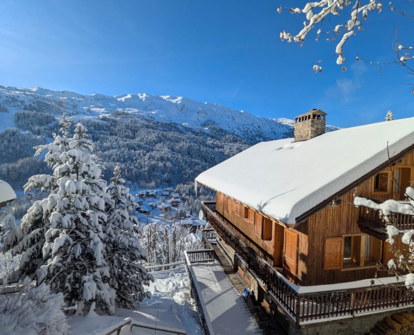 Ski Chalet Loden in Meribel, France, in the snow with mountains in the background